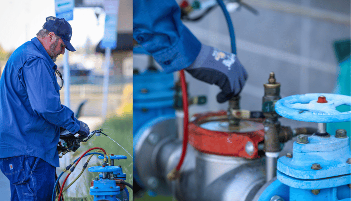 A water professional works on a water meter and valve system.